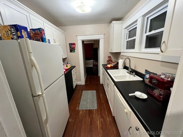 kitchen with dark wood-type flooring, white appliances, sink, and white cabinets