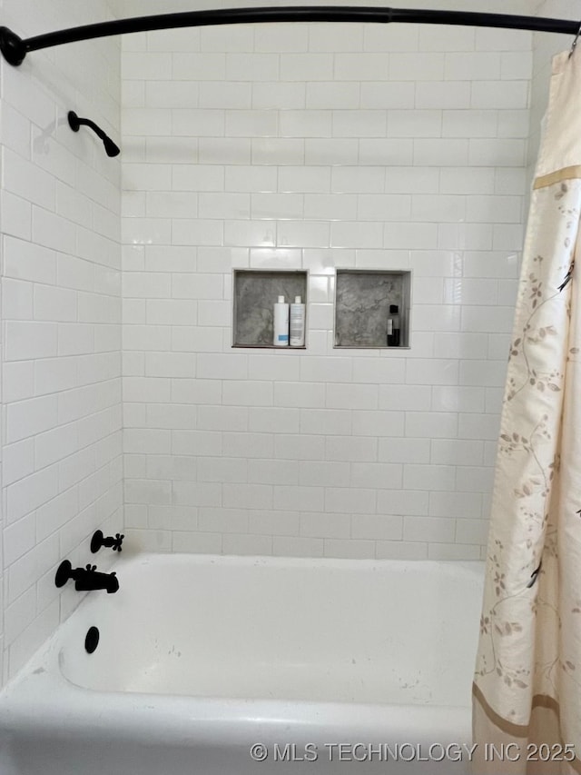 bathroom with shower / bath combination with curtain