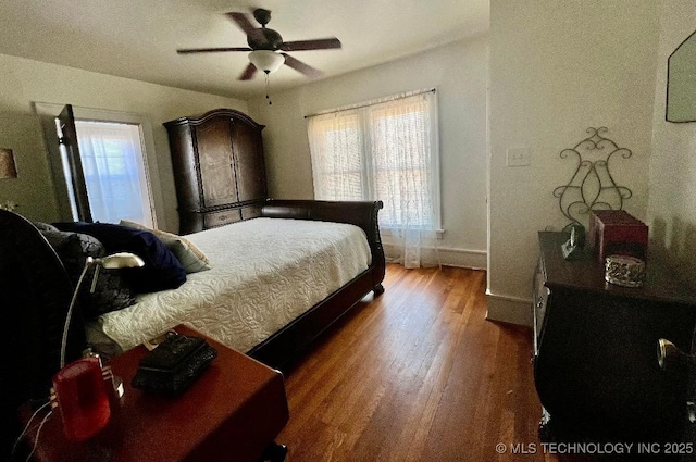 bedroom with hardwood / wood-style floors and ceiling fan