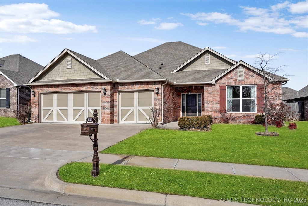 craftsman house with a garage and a front yard