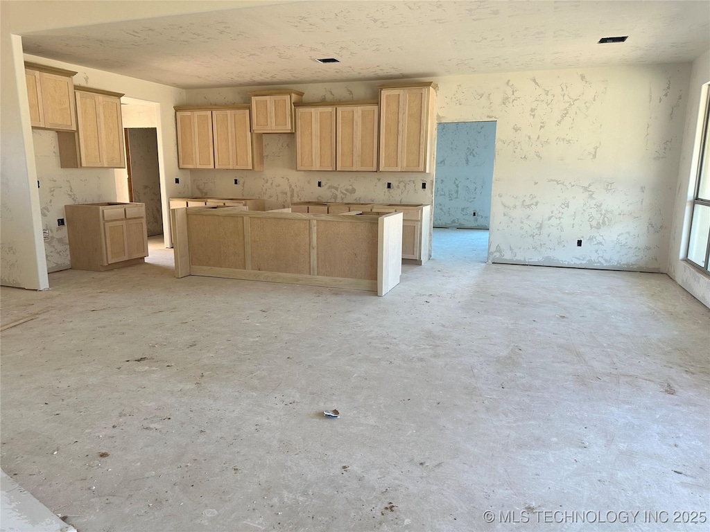 kitchen featuring light brown cabinetry