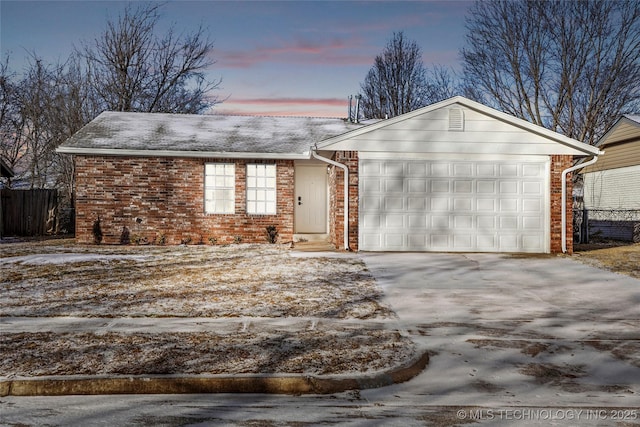 single story home featuring a garage