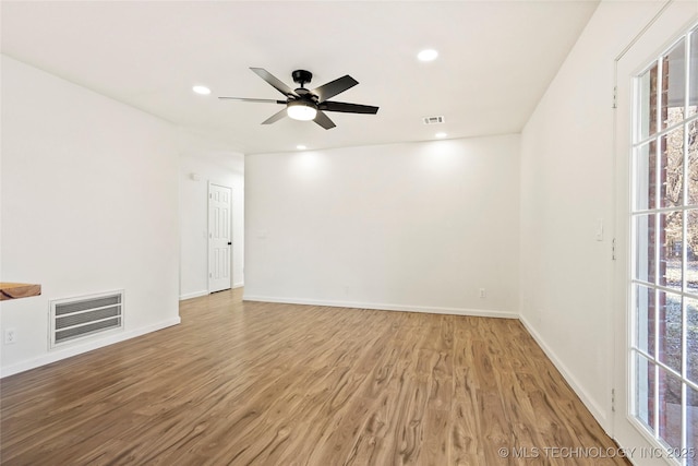 spare room featuring ceiling fan and wood-type flooring