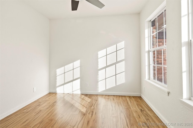 empty room with light hardwood / wood-style floors and ceiling fan