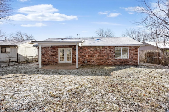 rear view of house featuring a patio area and french doors