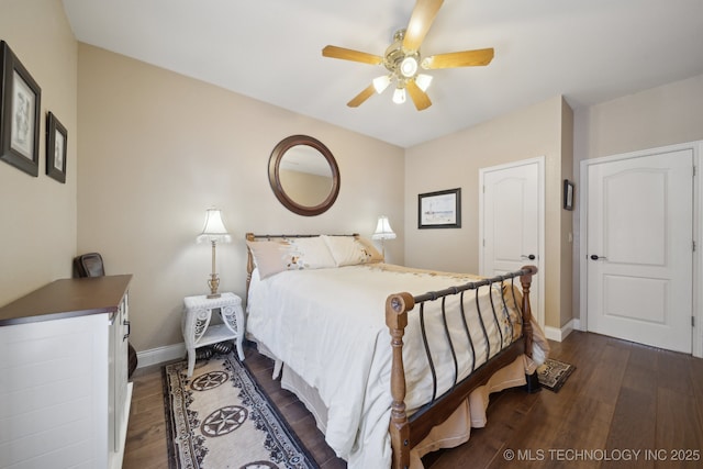 bedroom featuring dark wood-type flooring and ceiling fan