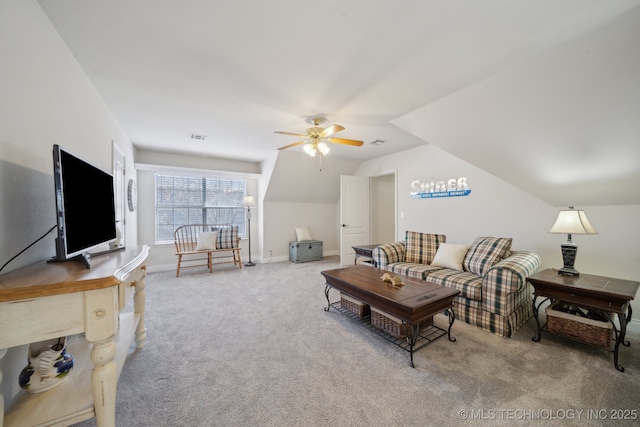 carpeted living room featuring ceiling fan and vaulted ceiling