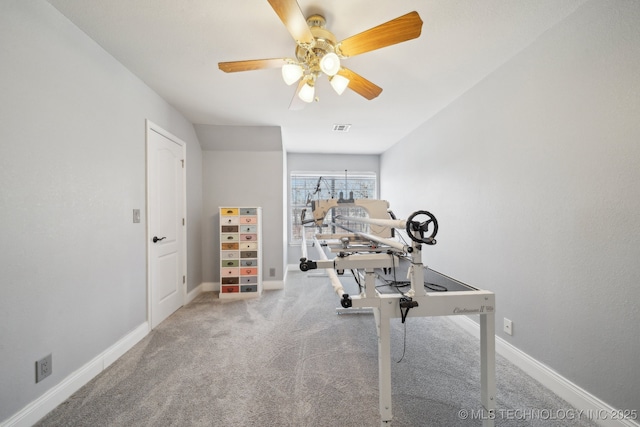 workout area with ceiling fan and carpet floors