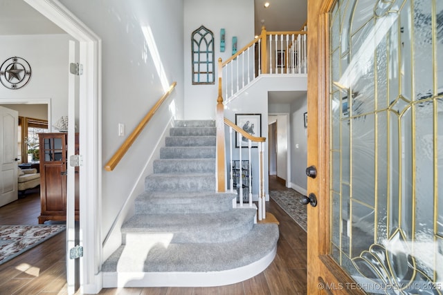 stairs featuring hardwood / wood-style flooring