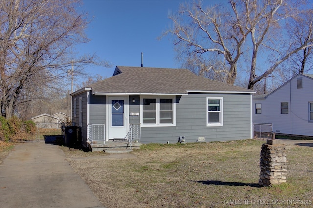 bungalow-style home featuring a front yard