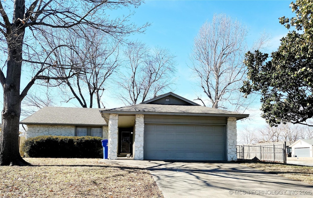 view of front of house with a garage and an outdoor structure