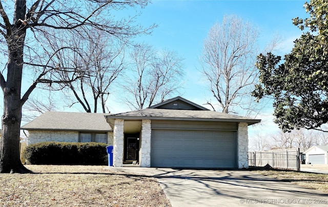 view of front of house with a garage and an outdoor structure