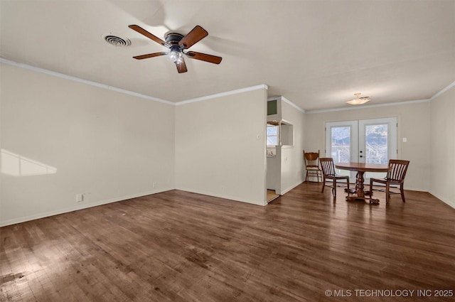 unfurnished living room featuring ceiling fan, dark hardwood / wood-style floors, crown molding, and french doors