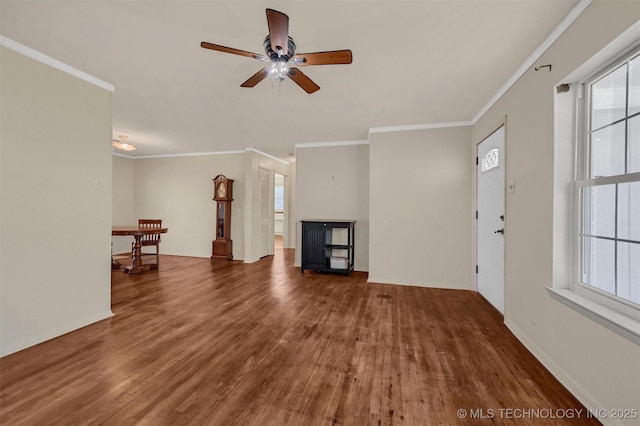 unfurnished living room with ceiling fan, crown molding, and dark hardwood / wood-style flooring