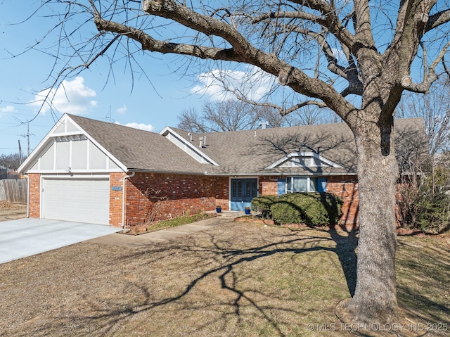 view of front of house with a garage and a front lawn