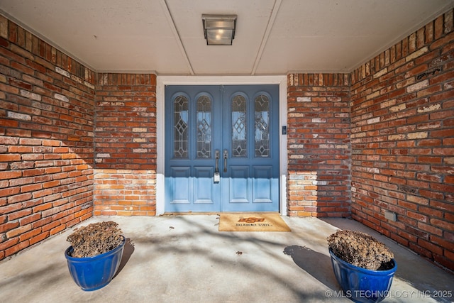 view of exterior entry featuring french doors