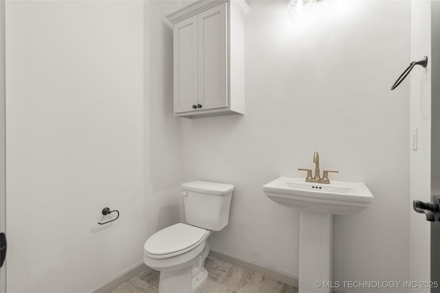 bathroom with sink and toilet