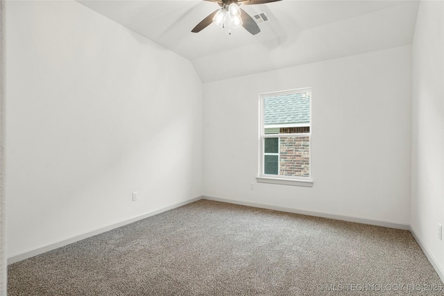 unfurnished room with lofted ceiling, ceiling fan, and carpet flooring