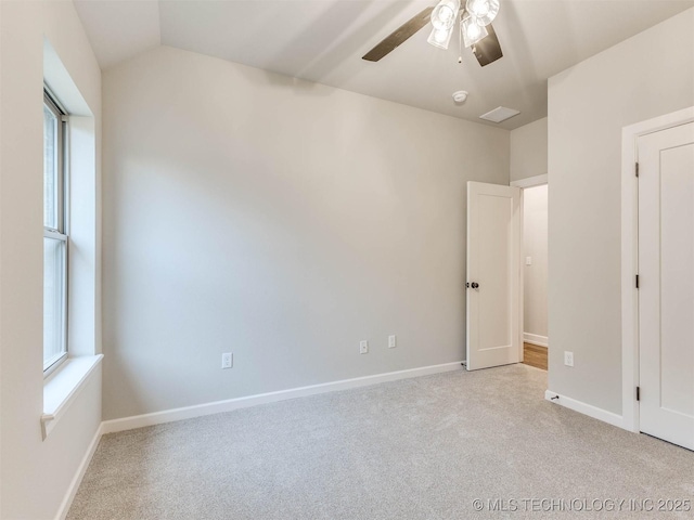 1412 N 70th St, Broken Arrow, OK 74014 - unfurnished bedroom with carpet, lofted ceiling, and a ceiling fan