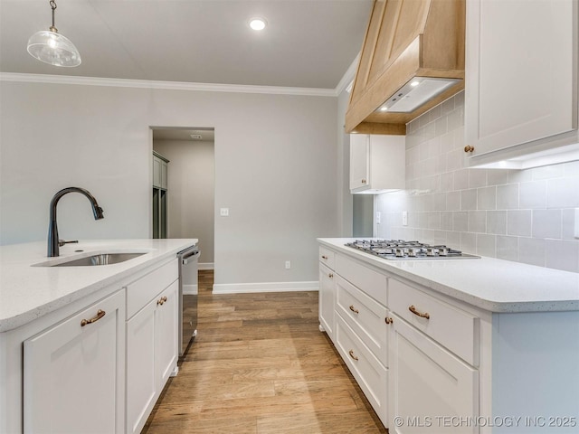 1412 N 70th St, Broken Arrow, OK 74014 - kitchen with custom exhaust hood, stainless steel appliances, ornamental molding, backsplash, and light wood finished floors
