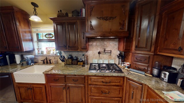 kitchen featuring decorative light fixtures, black dishwasher, sink, decorative backsplash, and stainless steel gas cooktop