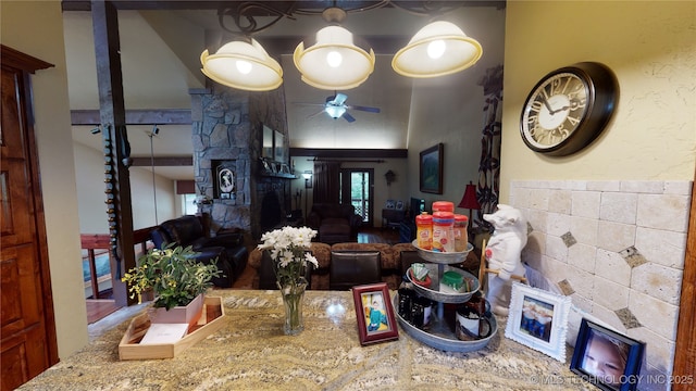 interior space with ceiling fan and a fireplace