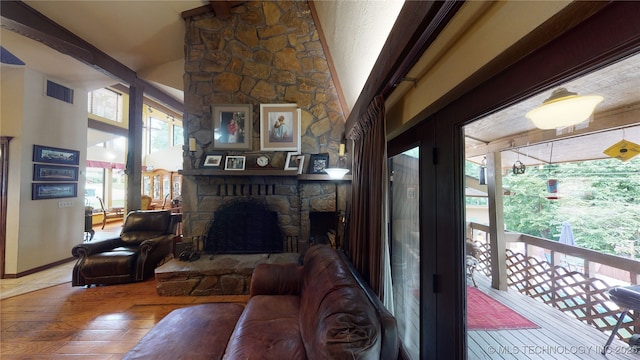 living room featuring wood-type flooring and a fireplace