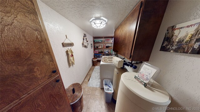 interior space with built in features, washer / clothes dryer, and a textured ceiling