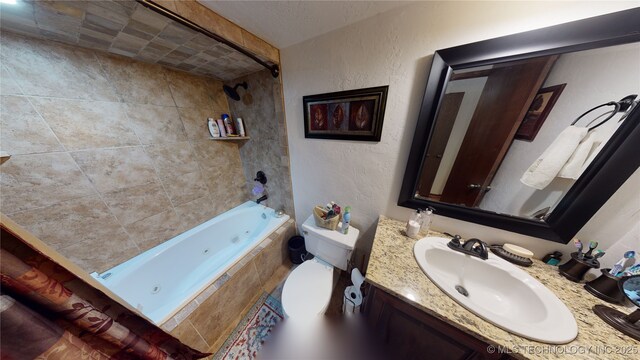 full bathroom with vanity, toilet, and tiled shower / bath combo