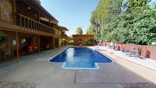 view of pool featuring a patio