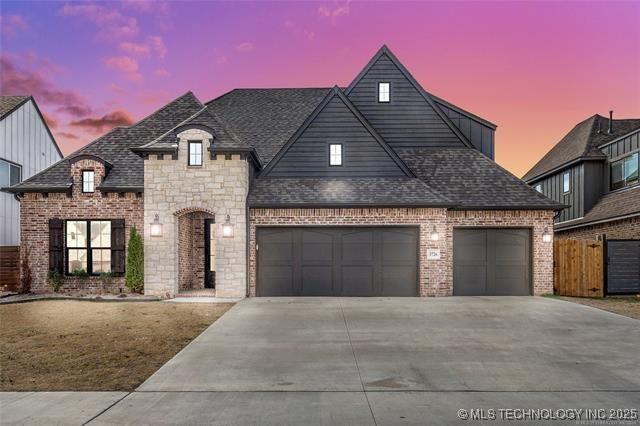 view of front of property with a garage