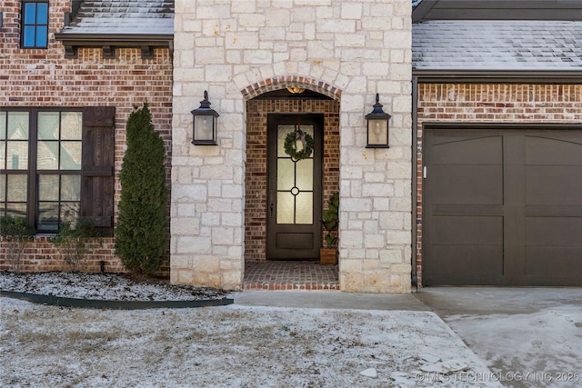 doorway to property featuring a garage