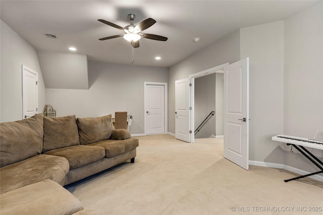 living room with ceiling fan and light colored carpet