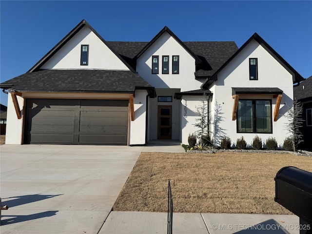 view of front facade with a garage and a front lawn