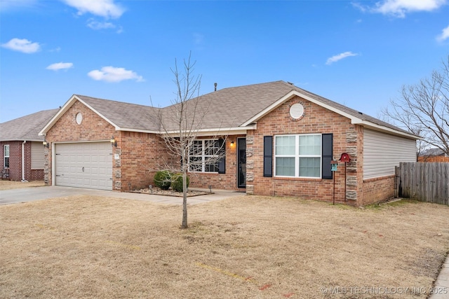 single story home with a garage and a front yard