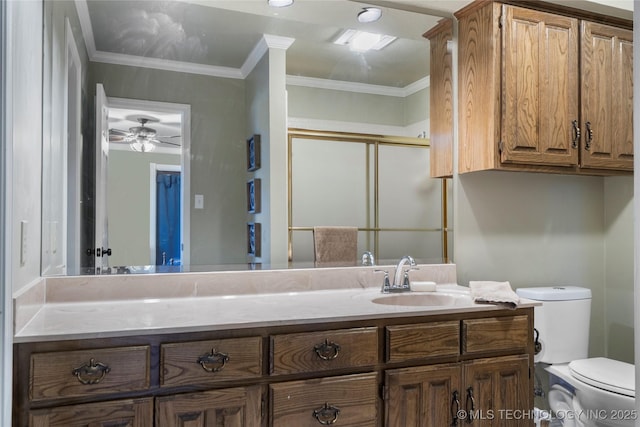 bathroom featuring crown molding, toilet, and vanity