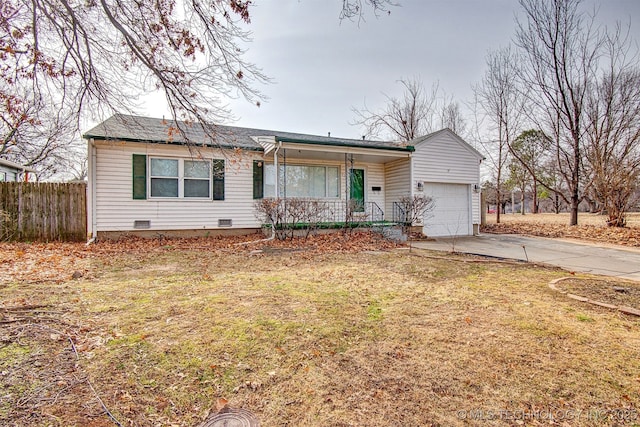 ranch-style home featuring a garage, a front lawn, and covered porch