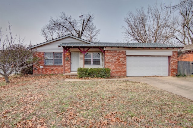 ranch-style home featuring a garage and a front yard