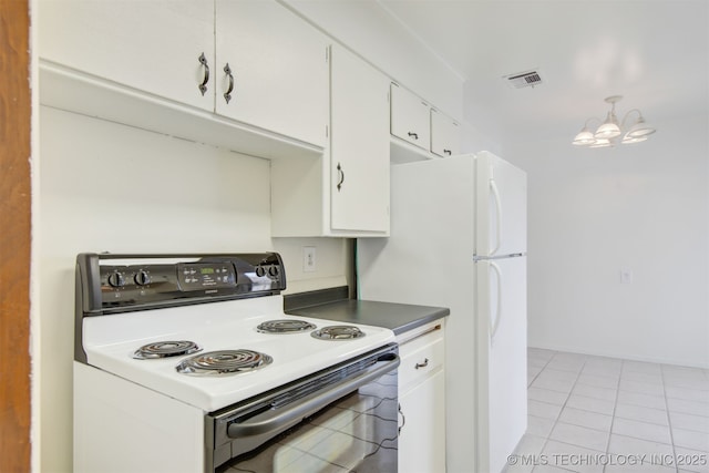 kitchen featuring light tile patterned floors, electric range, white cabinets, and an inviting chandelier