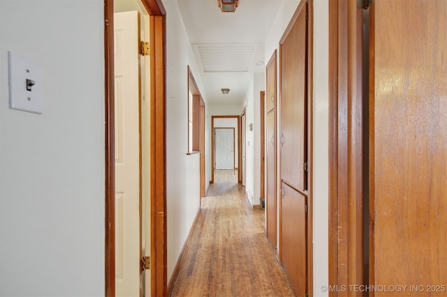 corridor featuring light hardwood / wood-style floors