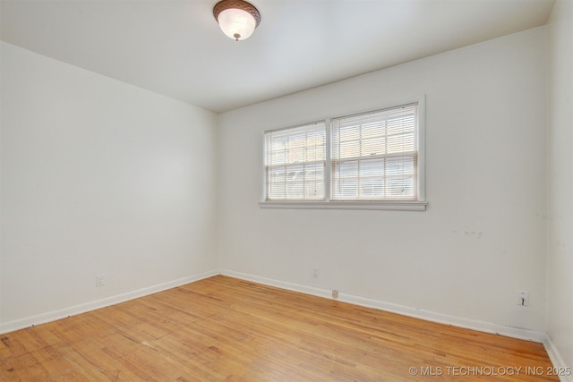 unfurnished room with light hardwood / wood-style flooring