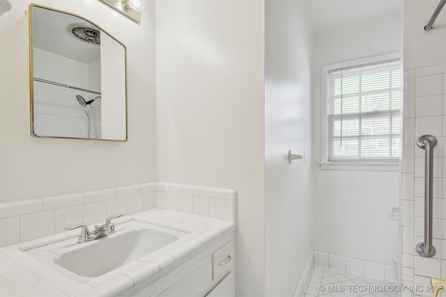 bathroom with vanity and tile patterned flooring