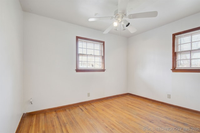 empty room featuring light hardwood / wood-style flooring and ceiling fan