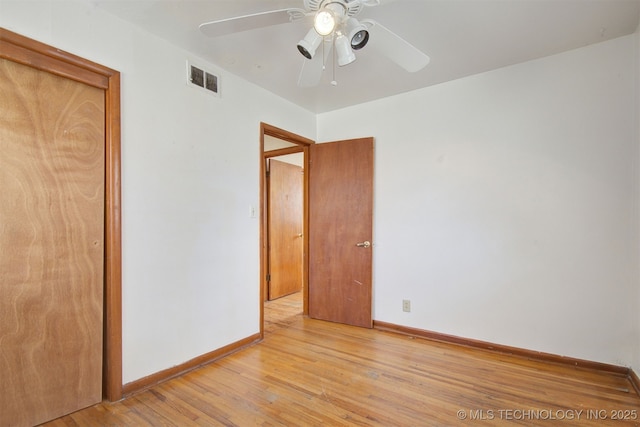 unfurnished bedroom with ceiling fan and light hardwood / wood-style floors