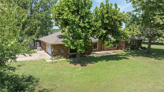 view of yard featuring a garage