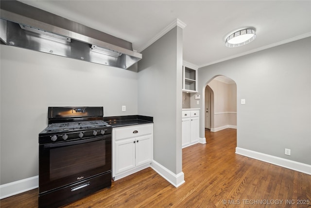 kitchen with gas stove, dark wood-type flooring, white cabinetry, built in features, and ventilation hood