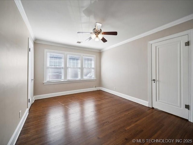 empty room with ceiling fan, dark hardwood / wood-style flooring, and crown molding