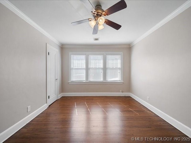 empty room featuring dark hardwood / wood-style flooring, ceiling fan, and ornamental molding