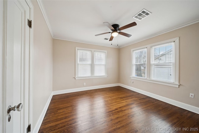 spare room with ceiling fan, crown molding, and dark hardwood / wood-style flooring