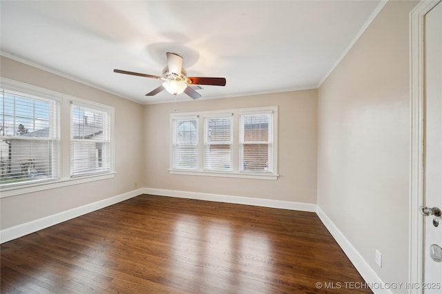 spare room featuring crown molding, dark hardwood / wood-style floors, and ceiling fan